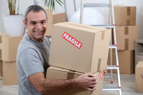 Removal van and moving team near Brompton residential streets