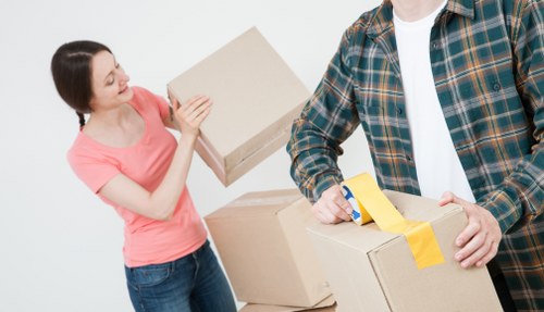 Moving boxes and furniture in a Brompton flat with narrow access