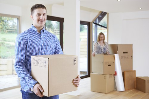 Packed household boxes and furniture prepared for Brompton relocation