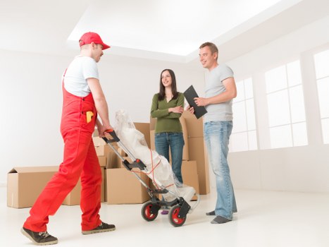 Business relocation team setting up an office after moving in Brompton
