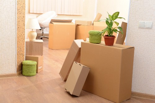 Loading furniture and boxes into a moving van for a Brompton property move